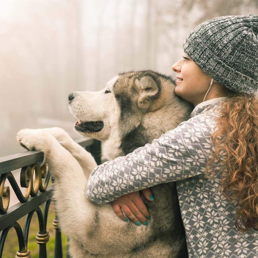 woman-hugging-dog